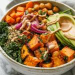 Best Sweet Potato Bowl Recipe: 5 Easy Ways to Make a Delicious Meal 6 sweet potato bowl with quinoa, roasted sweet potatoes, chickpeas, kale, avocado, and tahini dressing