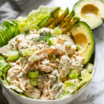 creamy keto chicken salad in a bowl with celery, dill, and lettuce cups