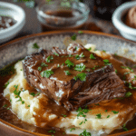 How to Make the Best Mississippi Pot Roast: A Step-by-Step Guide 6 Mississippi pot roast served over mashed potatoes with gravy