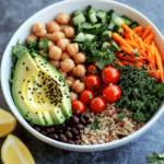 Best High Fiber Salad Recipe: 5 Delicious Ways to Boost Your Fiber Intake 6 Served high fiber salad bowl with quinoa, beans, avocado, kale, cherry tomatoes, cucumber, seeds, and herbs.