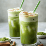 Served iced matcha horchata latte with cinnamon rice milk, green matcha, ice, and a light dusting of cinnamon.